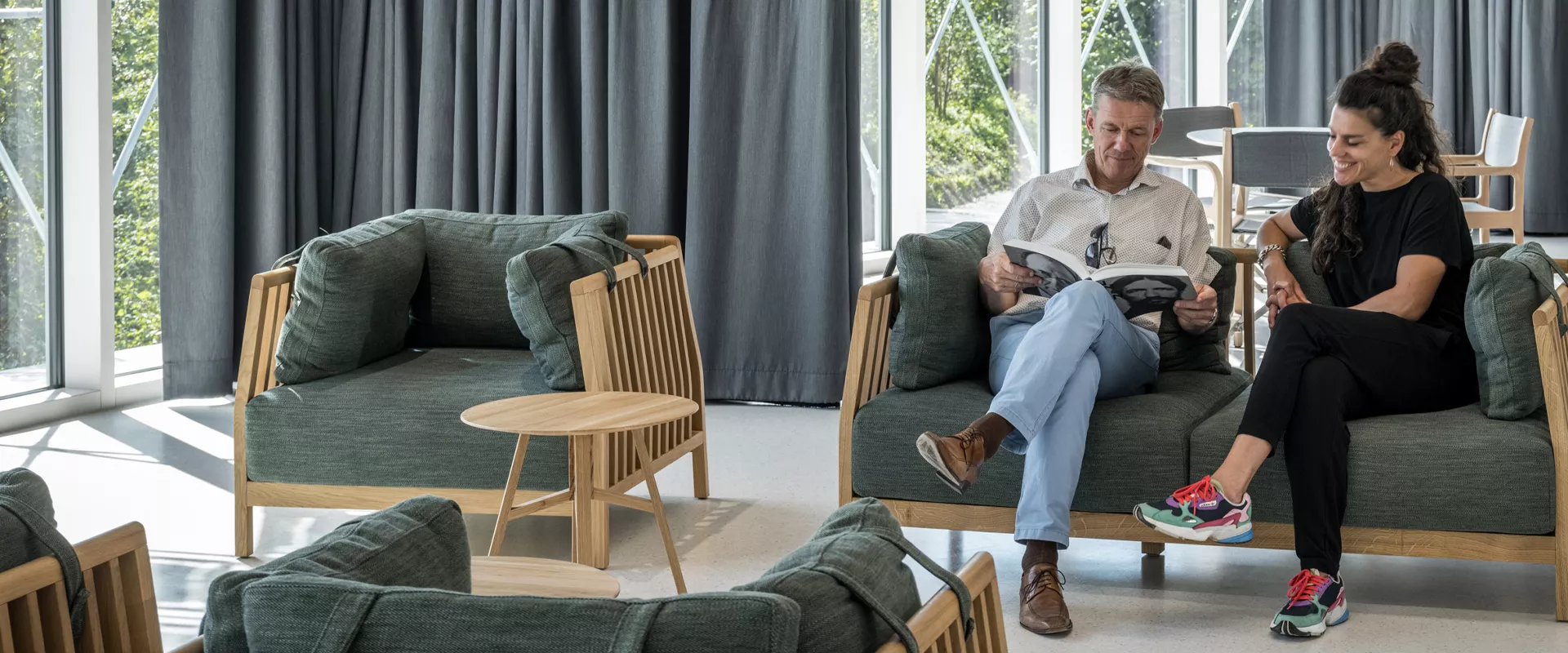 People relaxing on couches