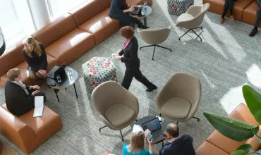 Group of business people in a meeting area Group of business people in a meeting area