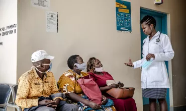 HCP discussing with patients in Africa HCP discussing with patients in Africa