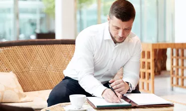 A business professional taking notes