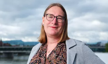A portrait of Stephie, Global Head of diversity, equity, and inclusion, responsible for disability equity at Novartis