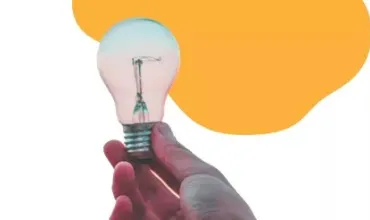 Hand holding lightbulb Hand holding lightbulb