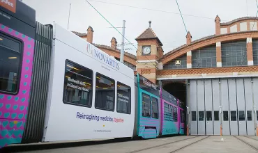 A Basel tram bearing the colors of the Eurovision song contest.