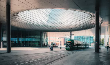 A Basel tram arrives at the Messeplatz station