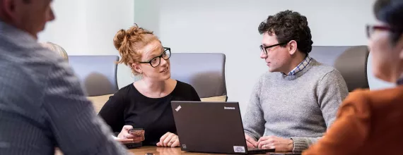 Business man and woman disccusing during a meeting