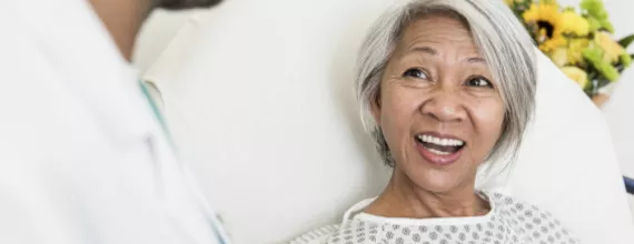 Woman smiling at doctor Woman smiling at doctor