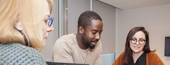 A group of three Novartis associates in a meeting