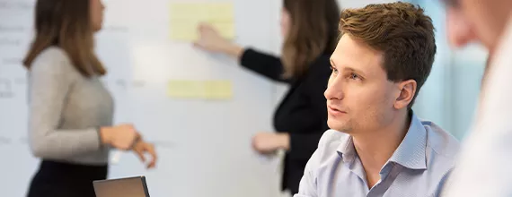 A Novartis business professional in a meeting