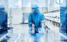 A Cell Processing Specialist at work in Novartis’ new cell and gene production facility in Stein, Switzerland.