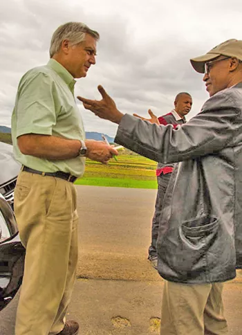 Dr. Jonathan D. Quick in the middle of a conversation
