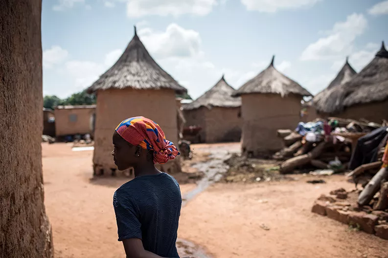 A girl walks home to her village