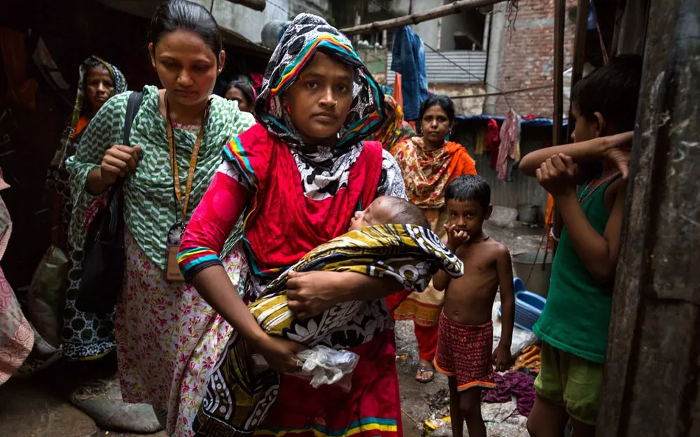 Fatima takes her 6-month-old son Foysal, who has pneumonia, for treatment in Dhaka, the capital of Bangladesh. Fatima takes her 6-month-old son Foysal, who has pneumonia, for treatment in Dhaka, the capital of Bangladesh.