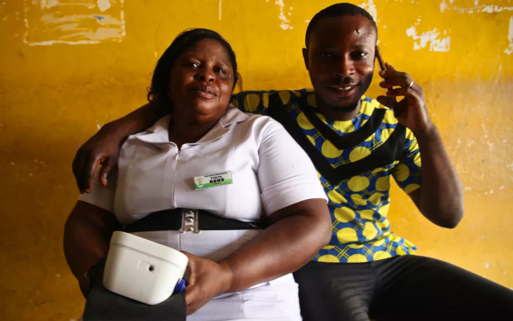 Nurse with blood pressure monitor Evelyn is a nurse in rural Ghana who specializes in cardiovascular disease.