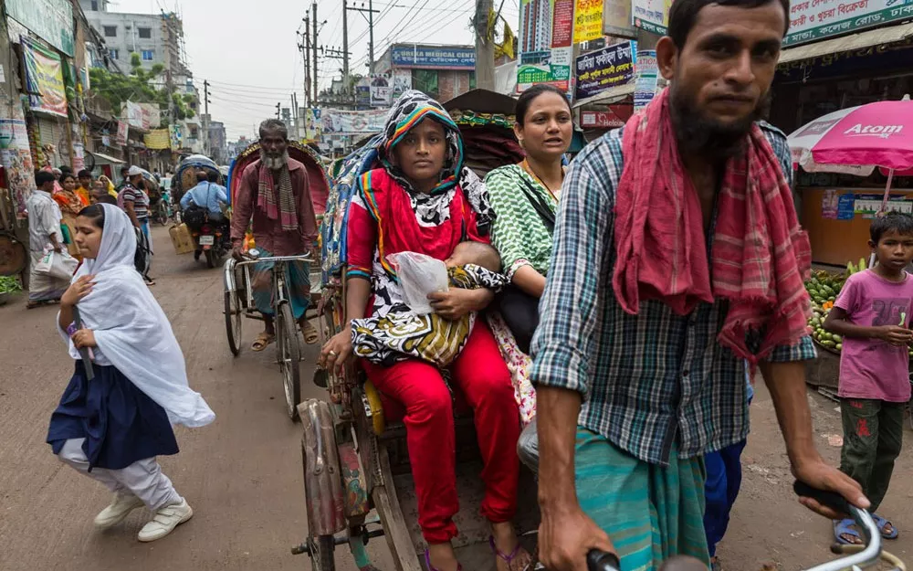 Fatima takes Foysal to the hospital in a rickshaw. Fatima takes Foysal to the hospital in a rickshaw.