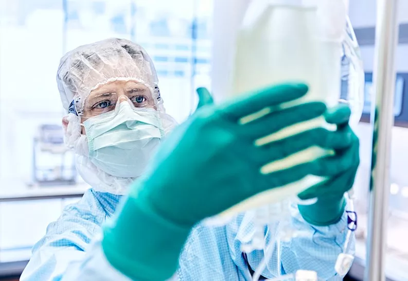 A Cell Processing Specialist at work in the production training environment A Cell Processing Specialist at work in the production training environment