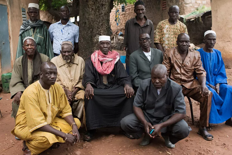 Adama Kone, the village chief in Bougoula, Mali, sits with his council of elders. Adama Kone, the village chief in Bougoula, Mali, sits with his council of elders.