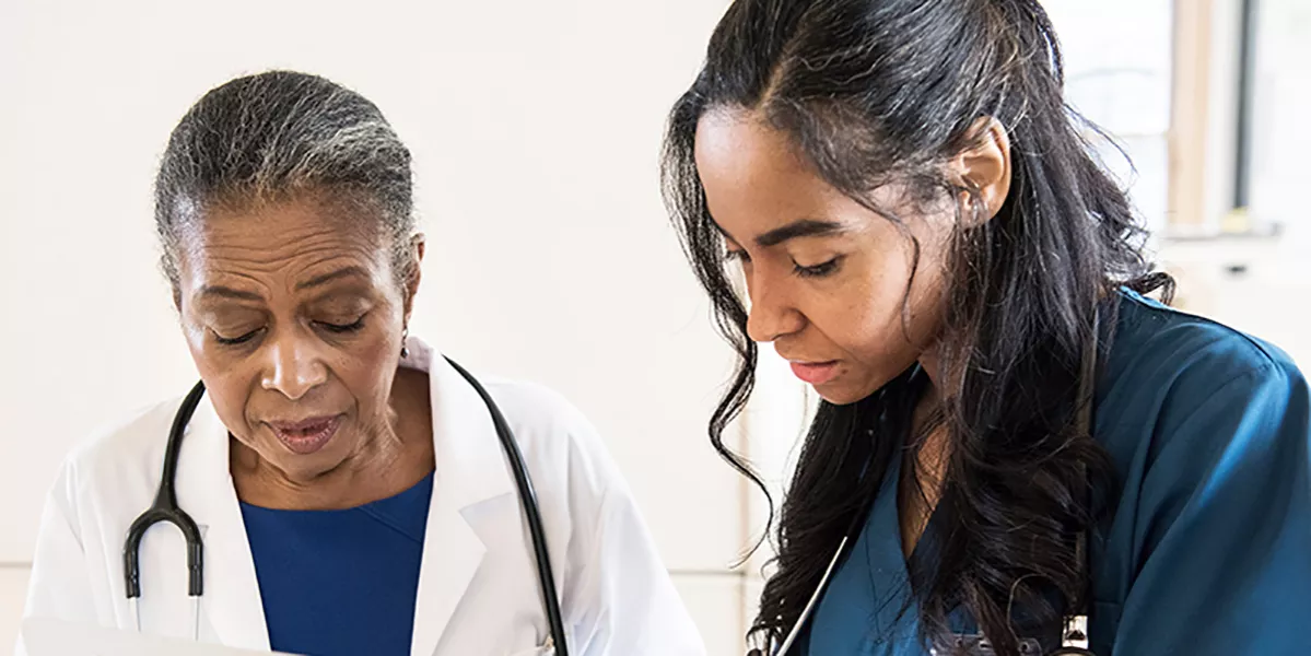 Image of two healthcare professionals interacting