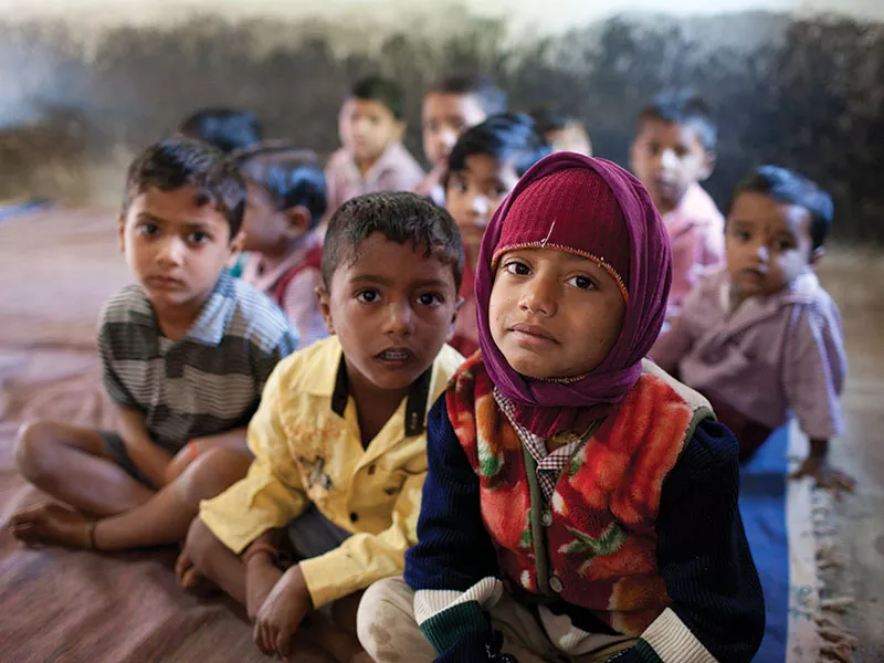 Children waiting at Arogya Parivar health camp in India Children waiting at Arogya Parivar health camp in India