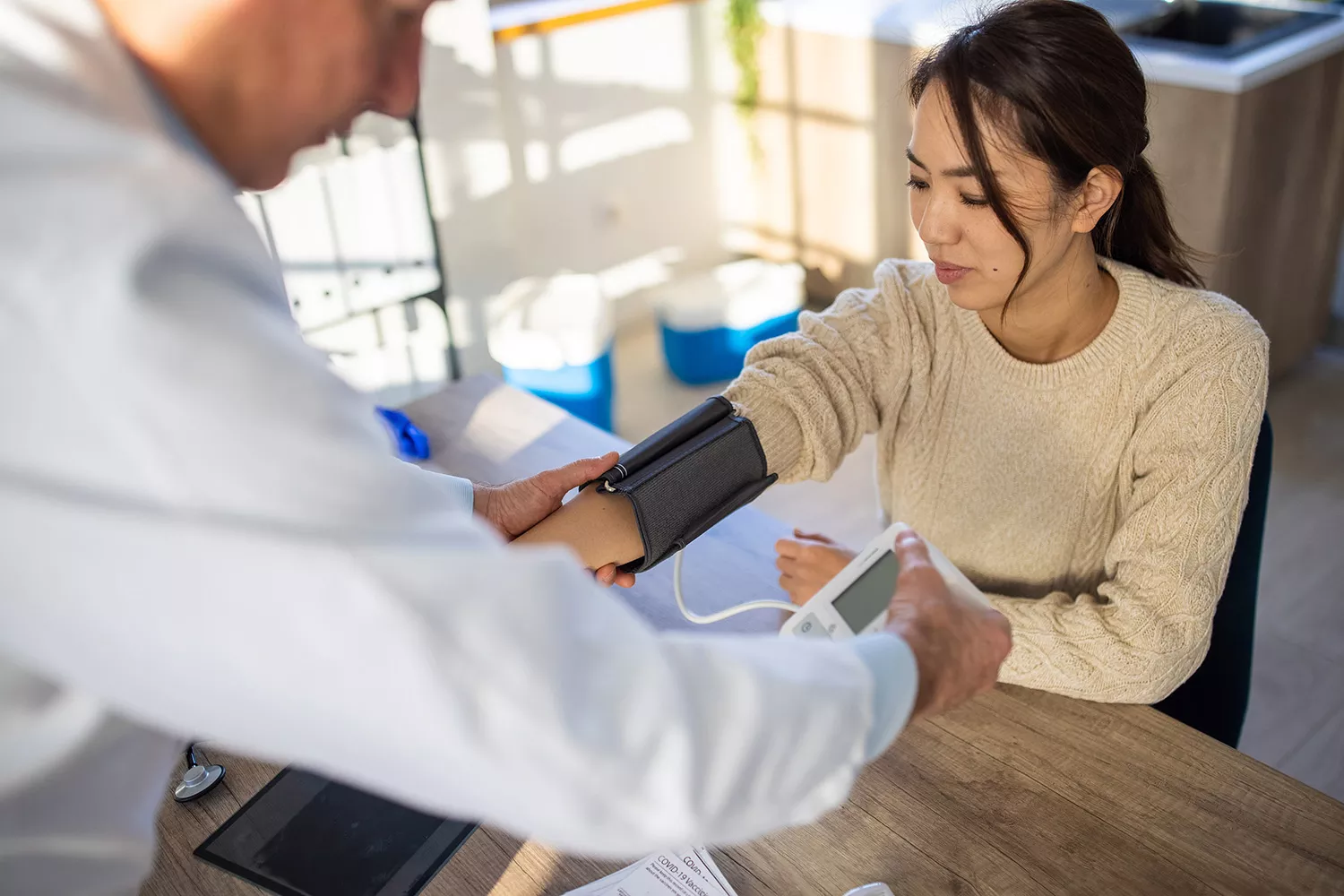 Doctor diagnosing a patient Doctor diagnosing a patient