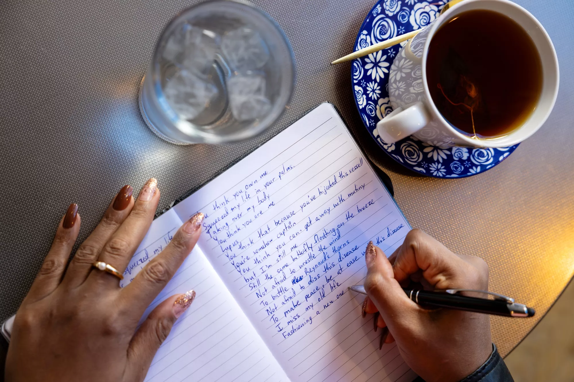 Shanelle works on a poem. Shanelle works on a poem.