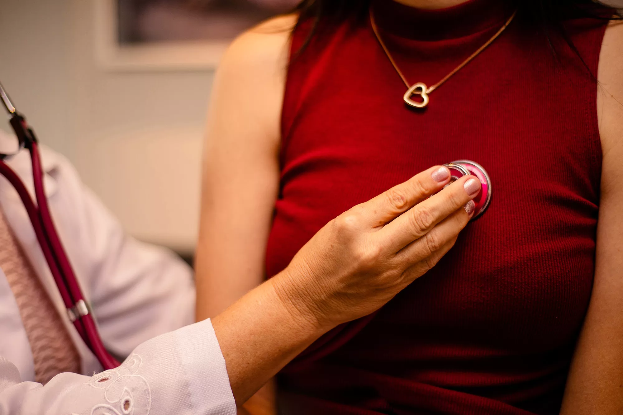 cardiologist listening to patients heart