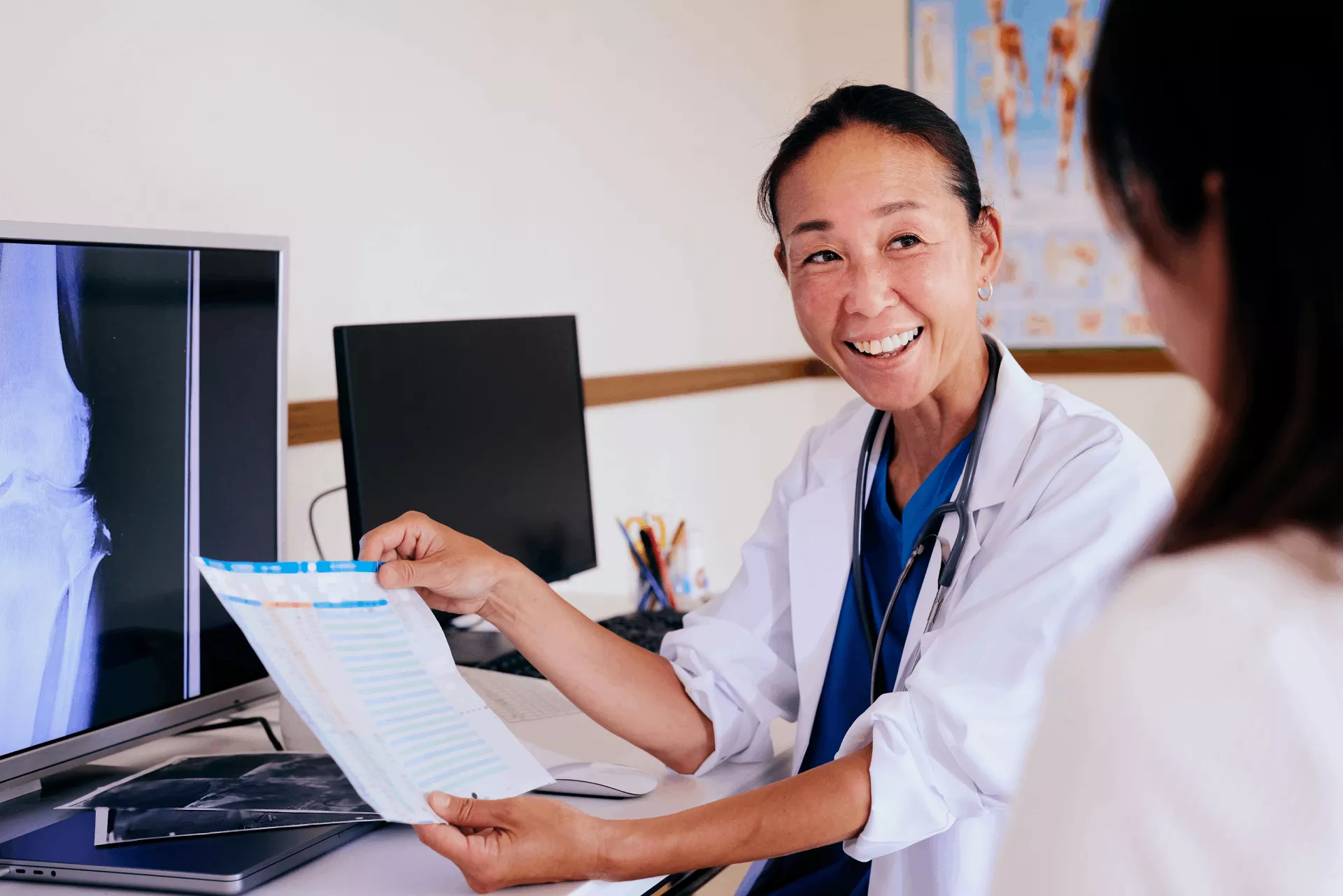 Doctor discusses results with patients Doctor discusses results with patients