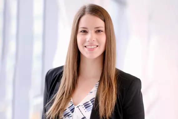 Portrait of Janelle Rychlick, a US-based associate
