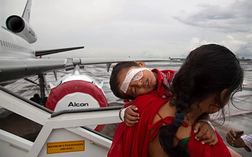 Sunita Singh holds her child