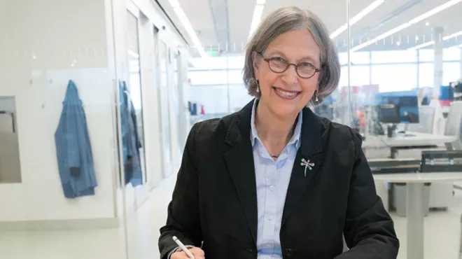 Cyndy Grosskreutz takes a moment to review projects