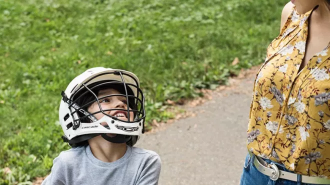 Mother takes son on bike ride in the park