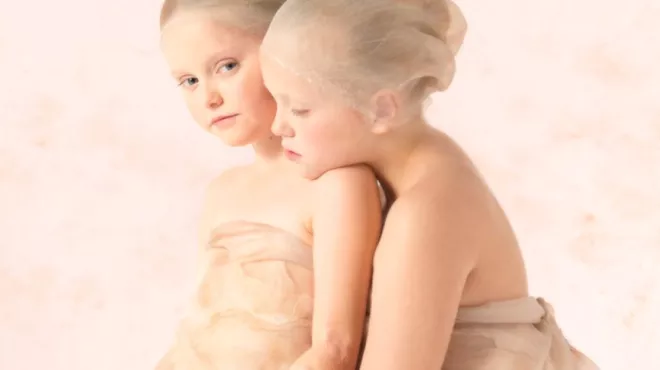 Two young girls posing for photoshoot