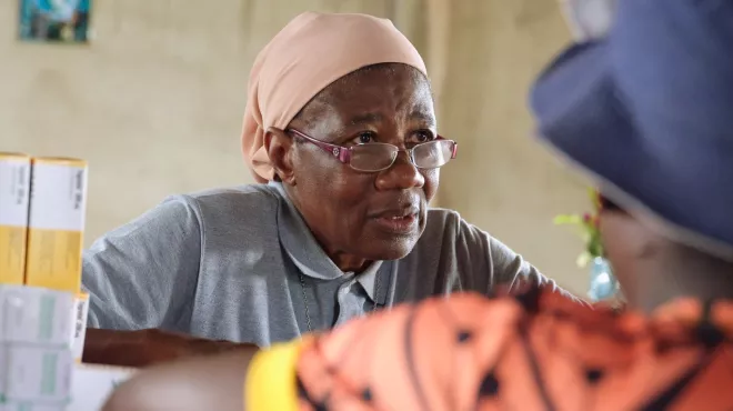 Sister Martine, a trained nurse, dispensing medicine at the Catholic mission’s health center in Ntui, Cameroon.