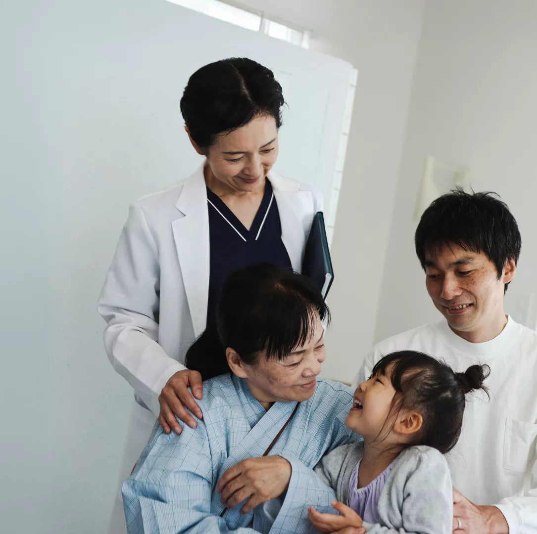 Patient with family around and doctor