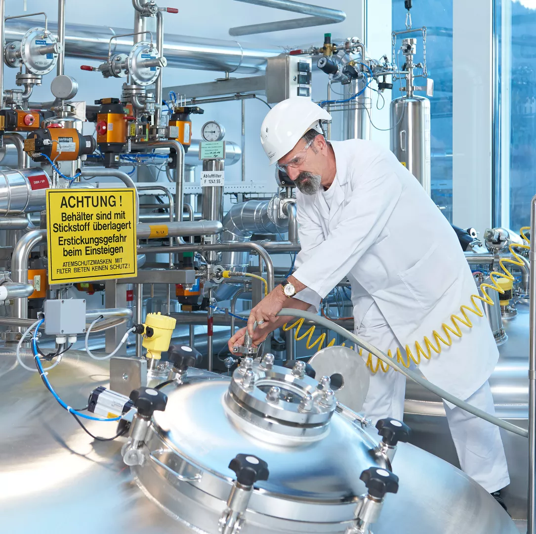 Production specialist checks tube