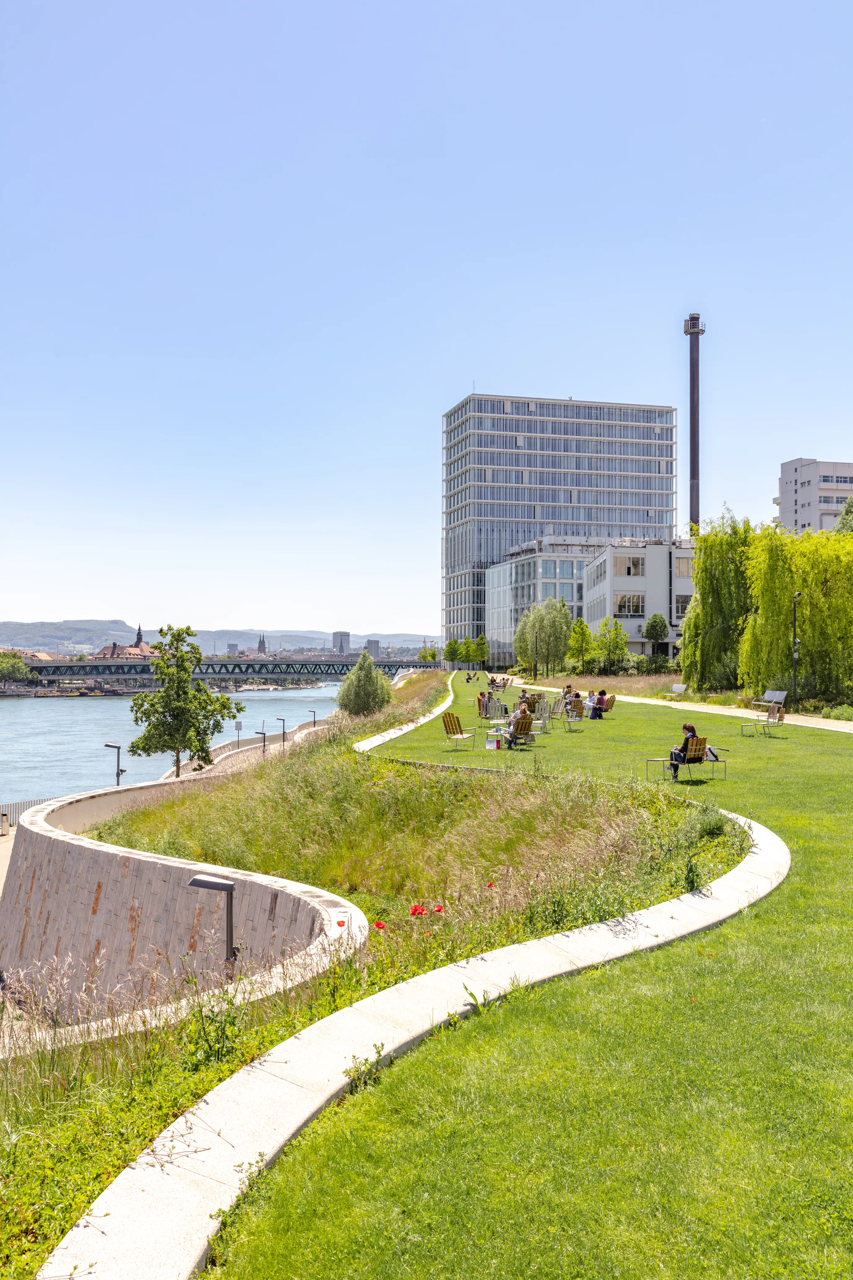 View of Asklepios 8 along the Rhine riverbank, Novartis Campus Basel View of Asklepios 8 along the Rhine riverbank, Novartis Campus Basel